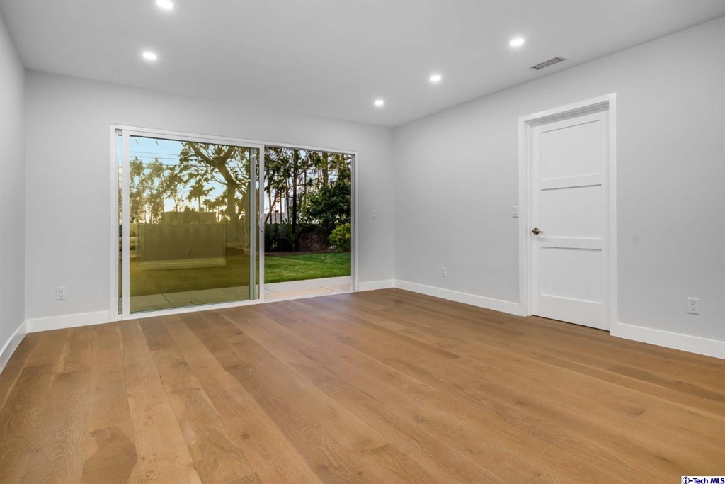 3840 Mayfair Drive Pasadena, CA 91107 - Photo 13 of 43 a view of an empty room with wooden floor and a window