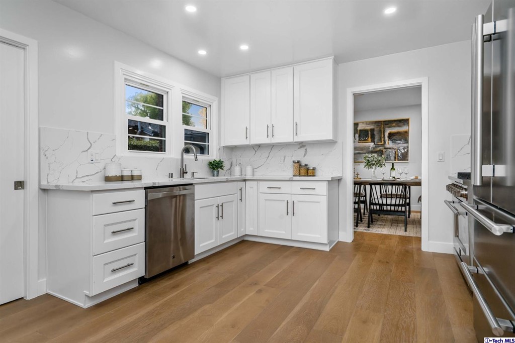 3840 Mayfair Drive Pasadena, CA 91107 - Photo 14 of 43 a kitchen with a stove a sink and a refrigerator