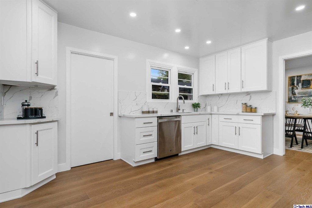 3840 Mayfair Drive Pasadena, CA 91107 - Photo 15 of 43 a kitchen with granite countertop a stove cabinets and wooden floor