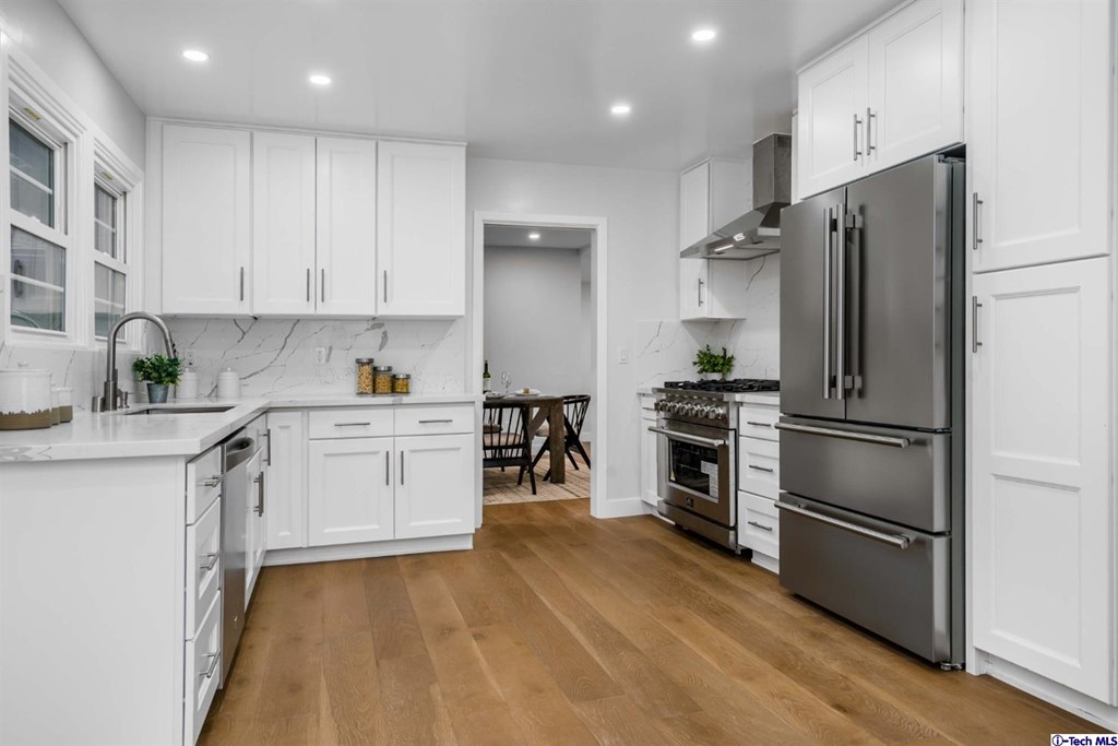 3840 Mayfair Drive Pasadena, CA 91107 - Photo 16 of 43 a kitchen with a refrigerator and a sink