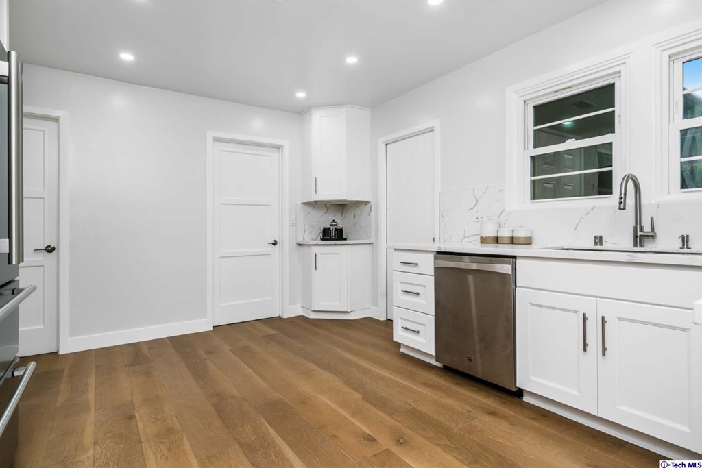 3840 Mayfair Drive Pasadena, CA 91107 - Photo 18 of 43 a kitchen with granite countertop a sink cabinets stainless steel appliances and a window