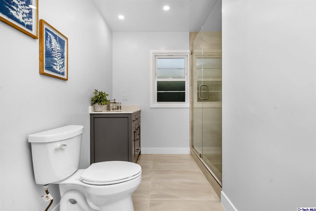 3840 Mayfair Drive Pasadena, CA 91107 - Photo 22 of 43 a white toilet sitting next to a bathroom sink