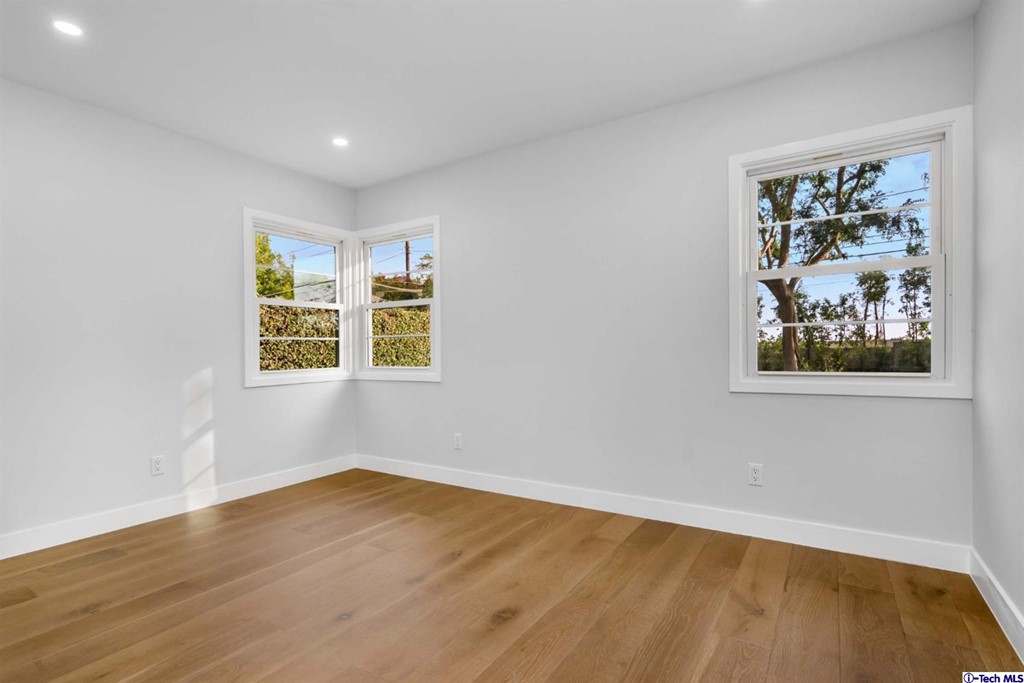 3840 Mayfair Drive Pasadena, CA 91107 - Photo 26 of 43 a view of an empty room with a window and wooden floor