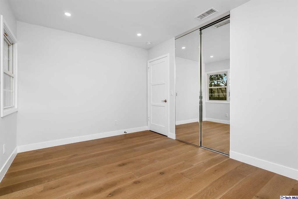 3840 Mayfair Drive Pasadena, CA 91107 - Photo 27 of 43 an empty room with wooden floor and windows