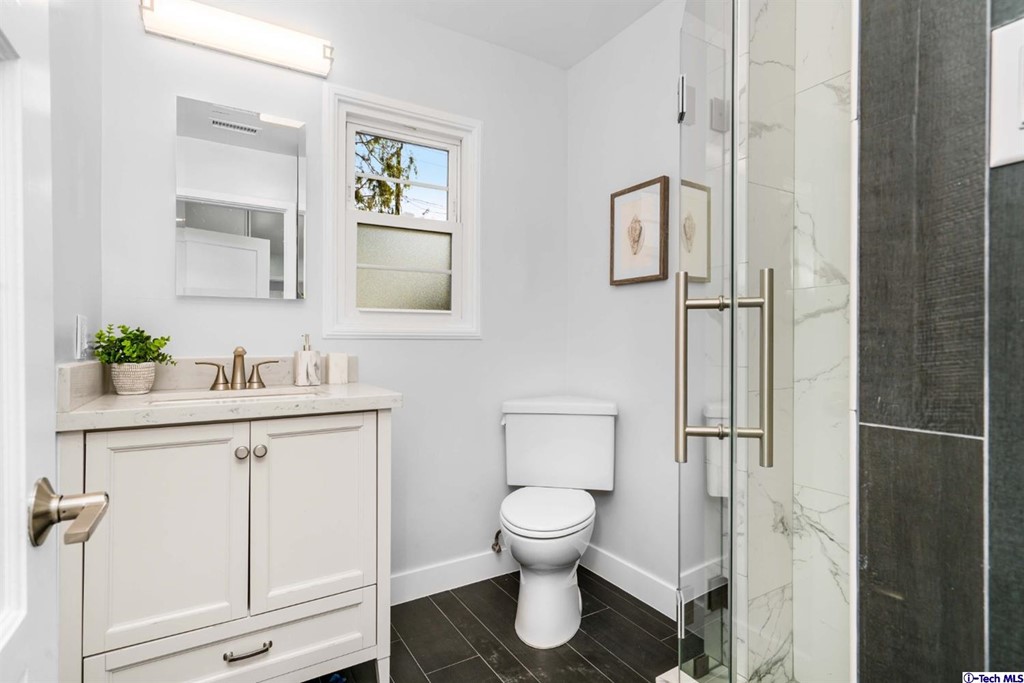 3840 Mayfair Drive Pasadena, CA 91107 - Photo 28 of 43 a bathroom with a toilet sink and mirror