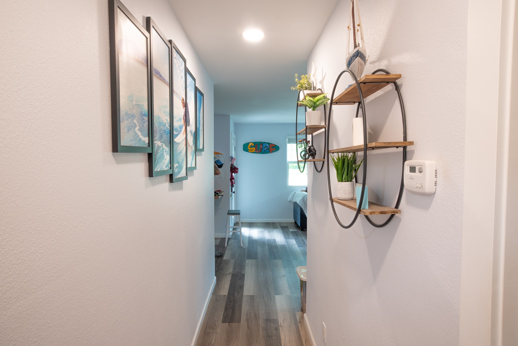 846 South Anderson Street Angleton, TX 77515 - Photo 7 of 30 This hallway features modern interior paint, laminate wood look floors, with great lighting to enhance the decor you decide to put on your walls.
