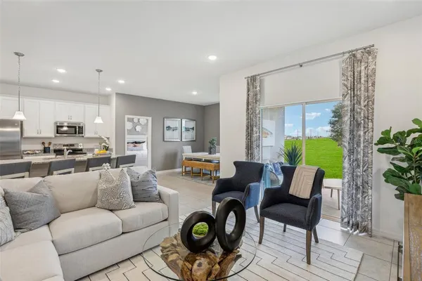 a living room with furniture and a large window