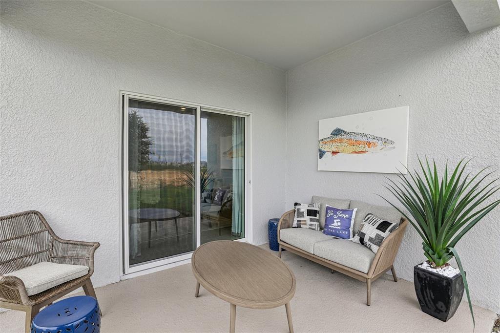 1885 Shadow Box Bend St. Cloud, FL 34771 - Photo 37 of 45 a living room with furniture and a potted plant