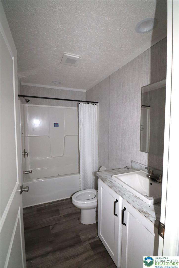 5020 Old Timber Road Stroudsburg, PA 18360 - Photo 22 of 32 a bathroom with a granite countertop sink toilet and shower