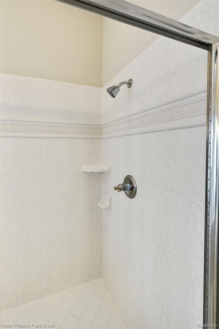 1400 Army Road Leonard, MI 48367 - Photo 30 of 56 Immaculate, neutral tile in Master bath.
