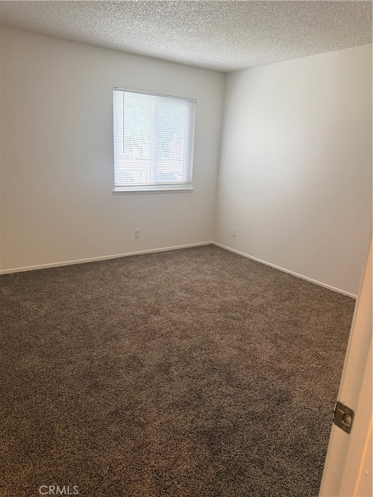 8990 19th Street, Unit 222 Rancho Cucamonga, CA 91701 - Photo 6 of 8 an empty room with a window