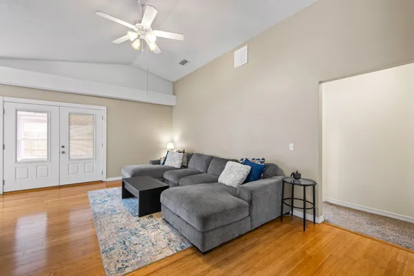 a living room with furniture and a window
