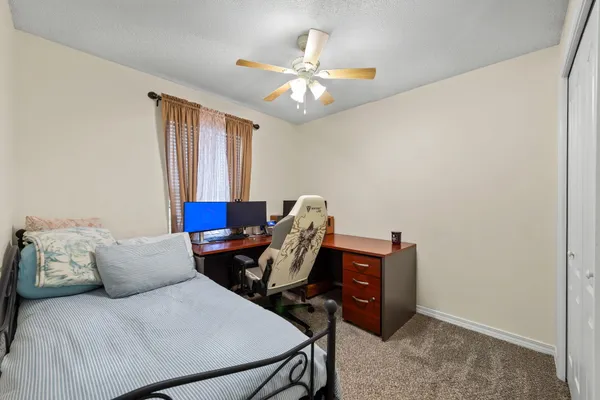 a work room with furniture and window
