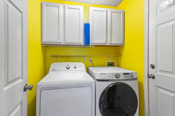 a utility room with dryer and washer