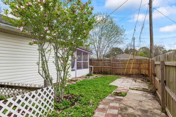 a view of a backyard with a fence