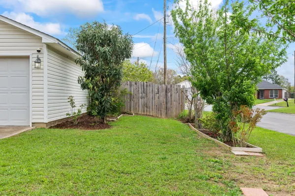 a view of a back yard of the house