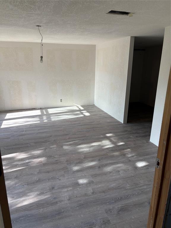 616 Breckenridge Highway Ranger, TX 76470 - Photo 15 of 16 a view of empty room with wooden floor