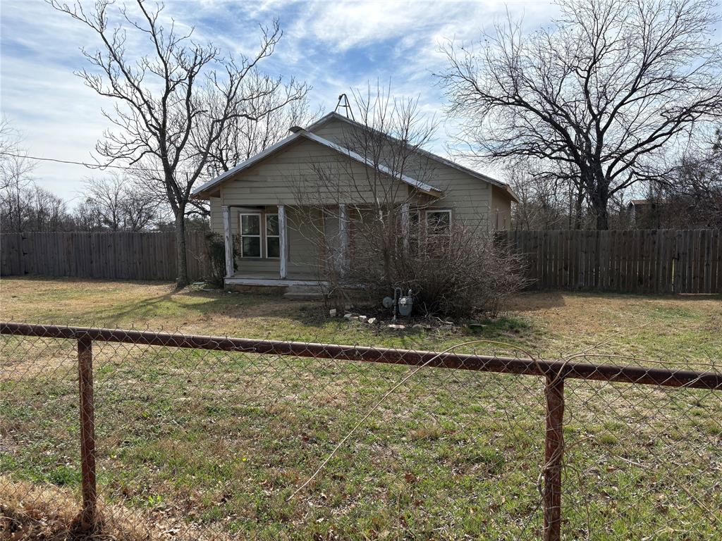 616 Breckenridge Highway Ranger, TX 76470 - Photo 2 of 16 a view of a brick house next to a yard with large tree