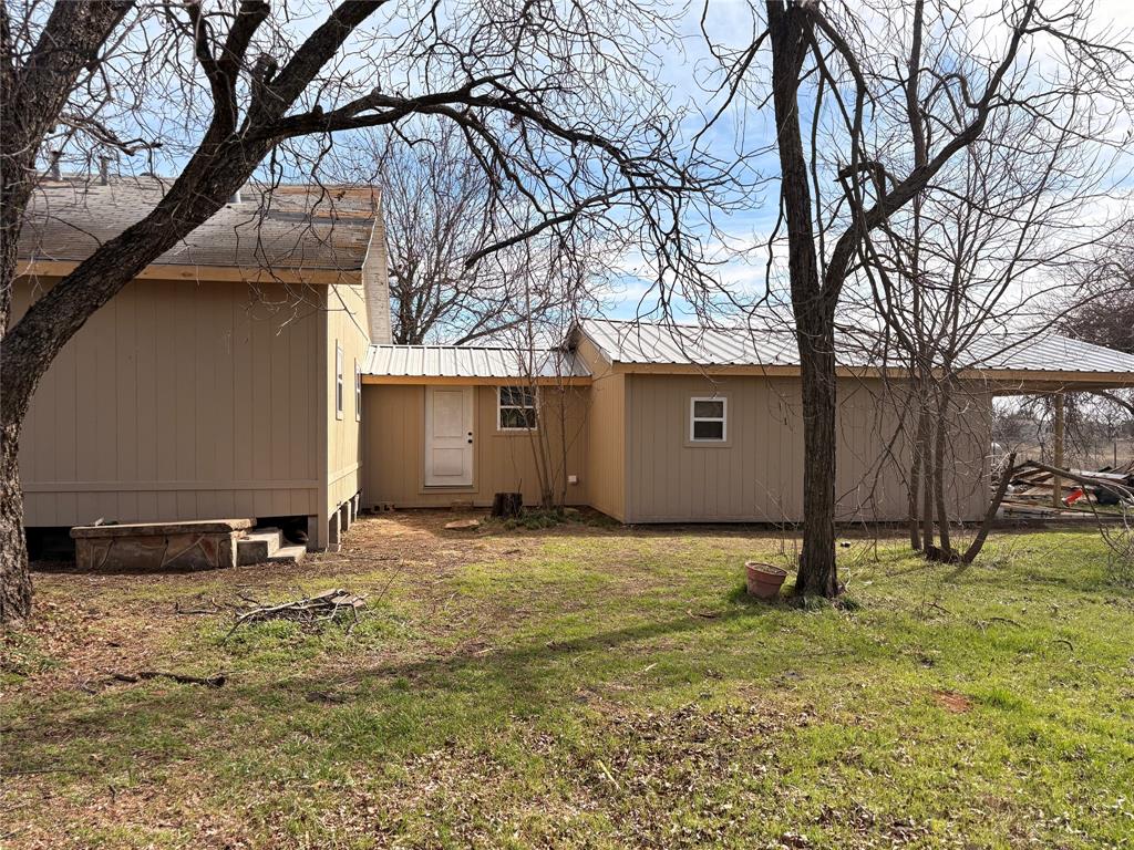 616 Breckenridge Highway Ranger, TX 76470 - Photo 3 of 16 a backyard of a house with barbeque oven and a tree
