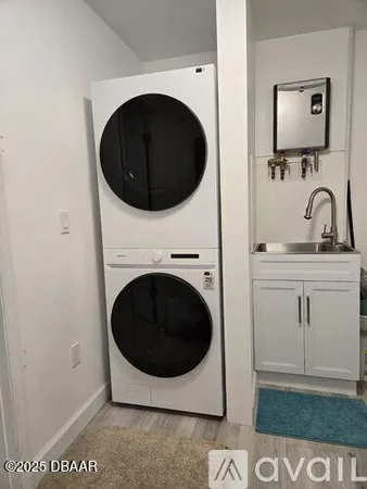a bathroom with a sink vanity and mirror
