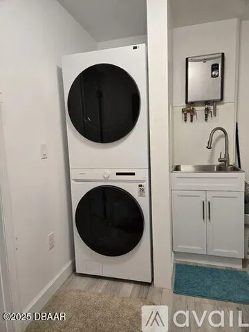 a bathroom with a sink vanity and mirror