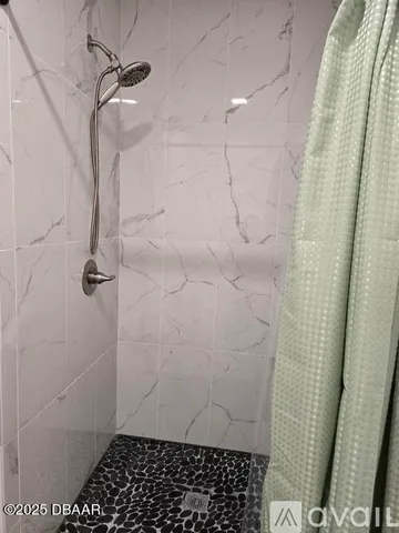 a bathroom with a sink mirror and vanity