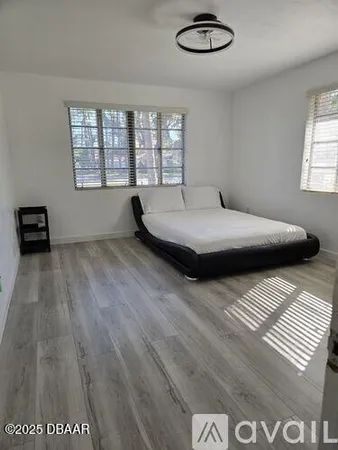 a view of a closet with wooden floor