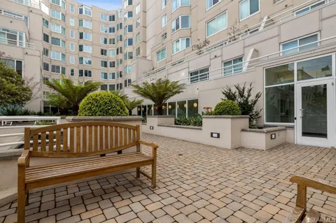 a bench sitting in front of building