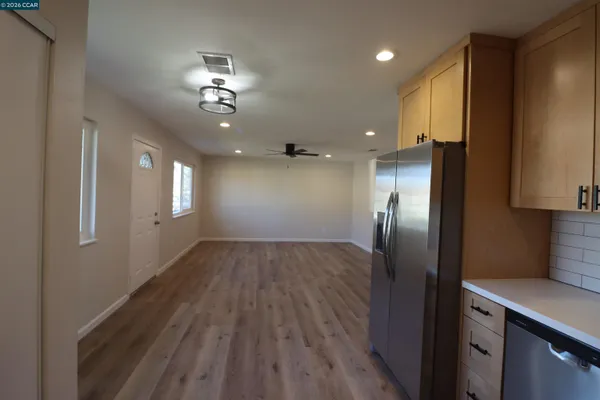 a view of a kitchen from the hallway