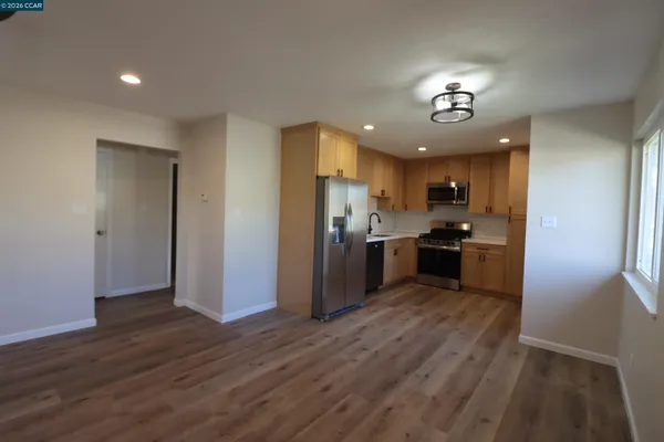 a view of kitchen with wooden floor