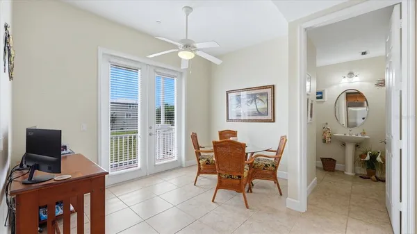 a view of a hallway with workspace and a window