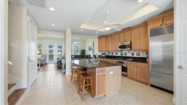 a kitchen with stainless steel appliances granite countertop a stove and a sink
