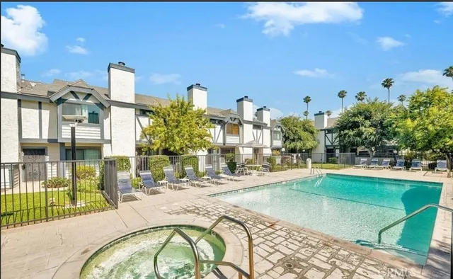 a swimming pool with outdoor seating and yard