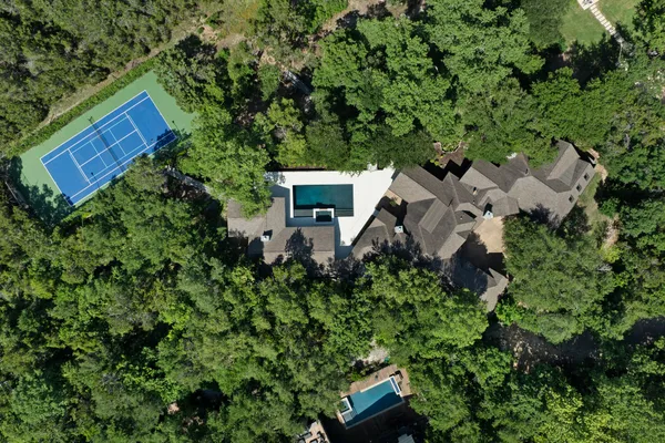 an aerial view of house with yard