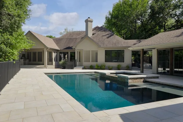 a view of a house with pool table and chairs