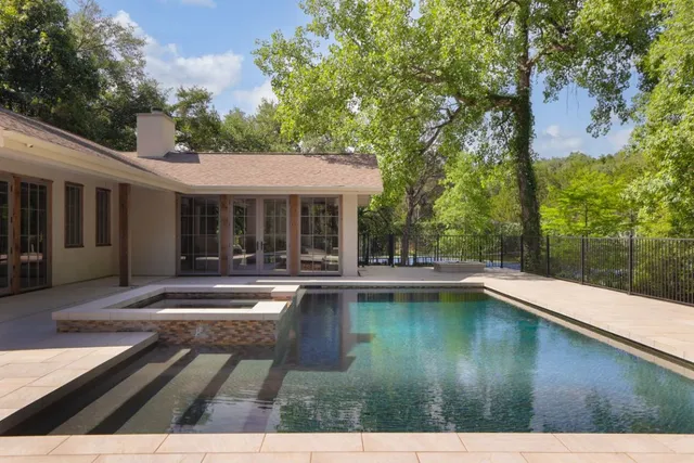 a view of a swimming pool with lounge chair