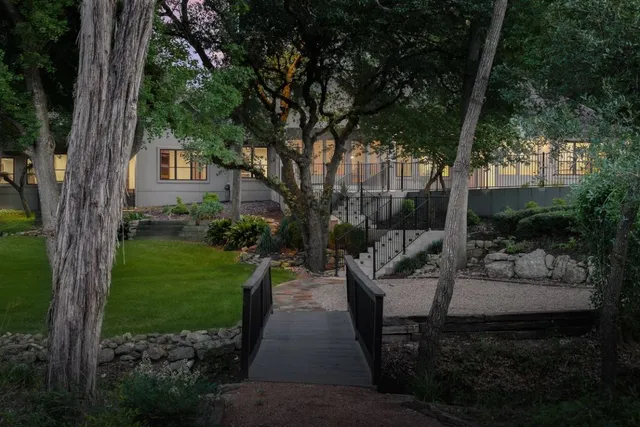 a view of a couches in the patio with a small yard