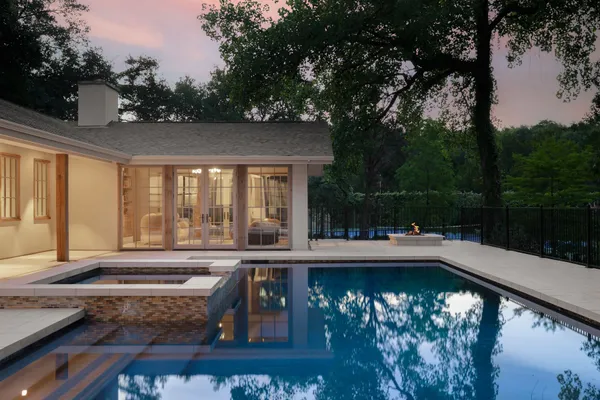 a view of swimming pool with chairs in patio
