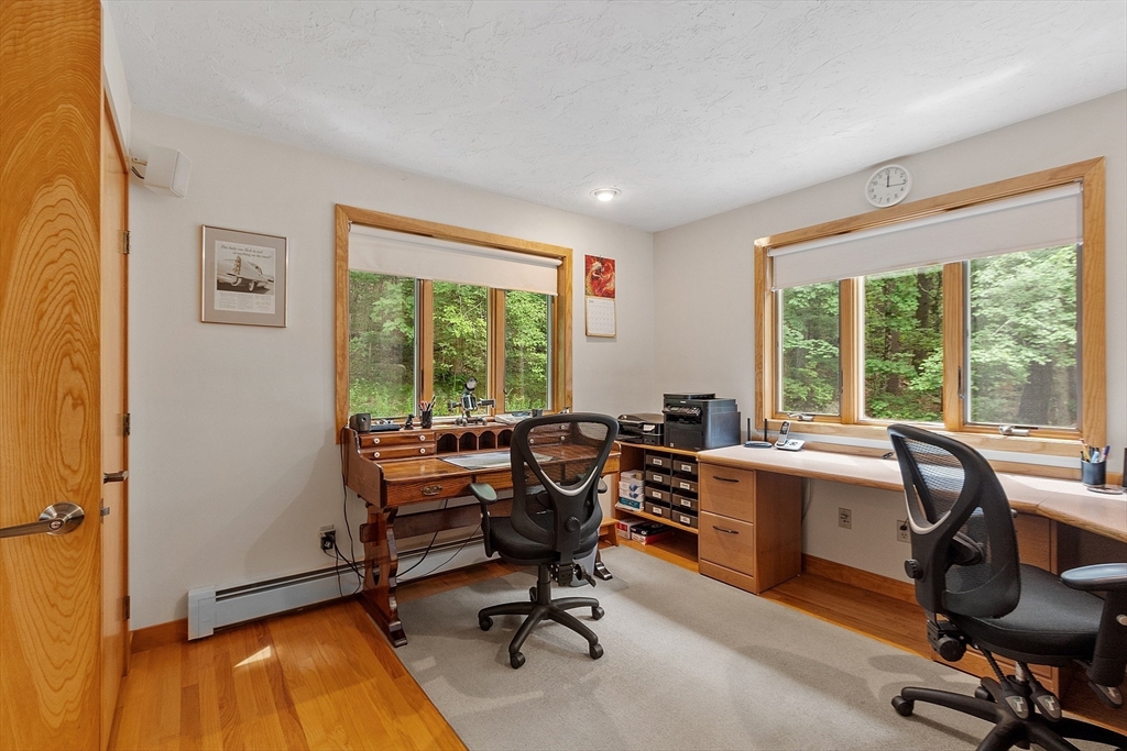 624 Old Harvard Road Boxborough, MA 01719 - Photo 15 of 42 a view of a workspace with hardwood and a window