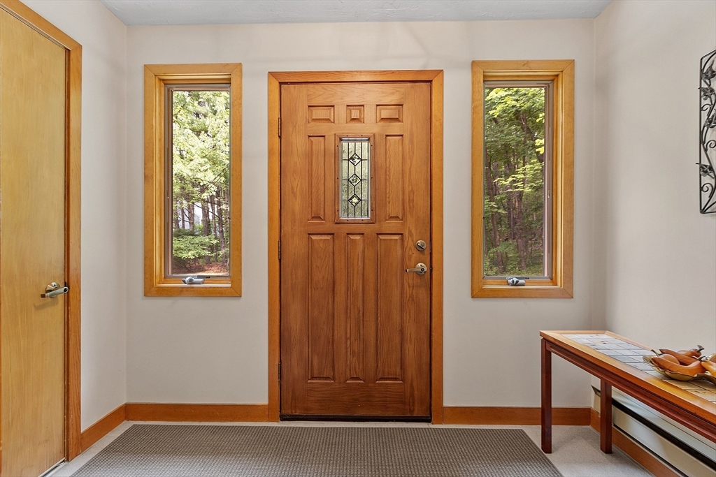 624 Old Harvard Road Boxborough, MA 01719 - Photo 17 of 42 a view of an entryway with wooden floor