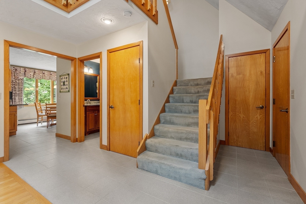 624 Old Harvard Road Boxborough, MA 01719 - Photo 18 of 42 a view of a hallway with wooden floor and entryway