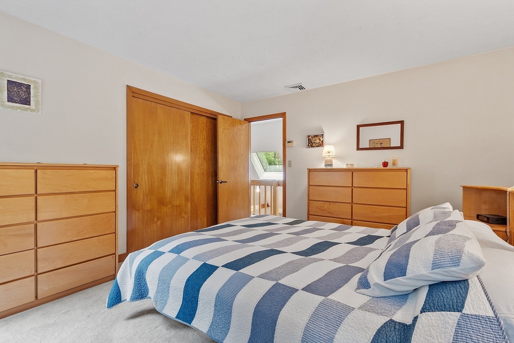 624 Old Harvard Road Boxborough, MA 01719 - Photo 22 of 42 a bedroom with a bed and a window