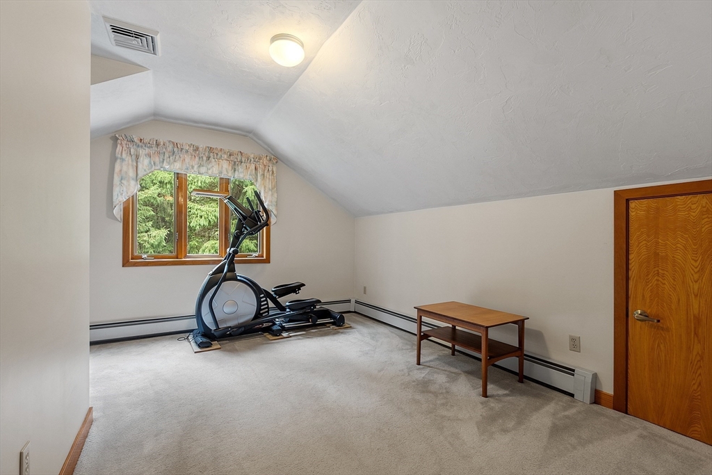 624 Old Harvard Road Boxborough, MA 01719 - Photo 30 of 42 a room with gym equipment and a large window