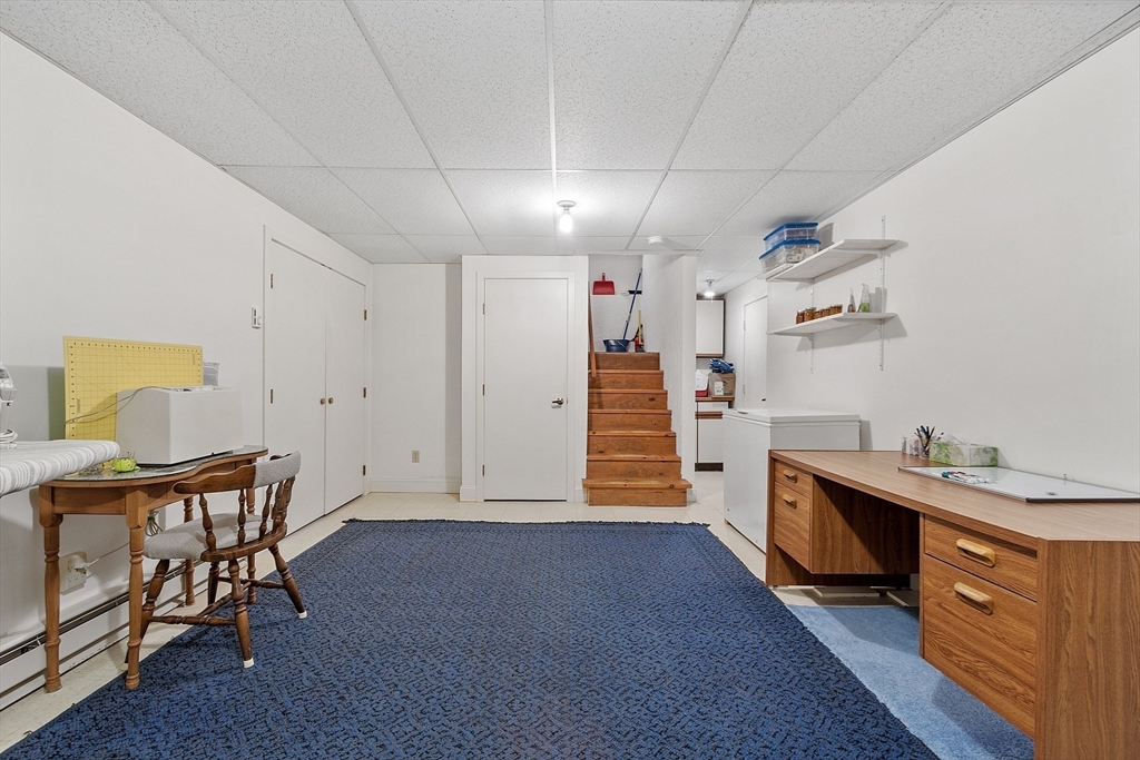 624 Old Harvard Road Boxborough, MA 01719 - Photo 33 of 42 a view of a kitchen with furniture and wooden floor