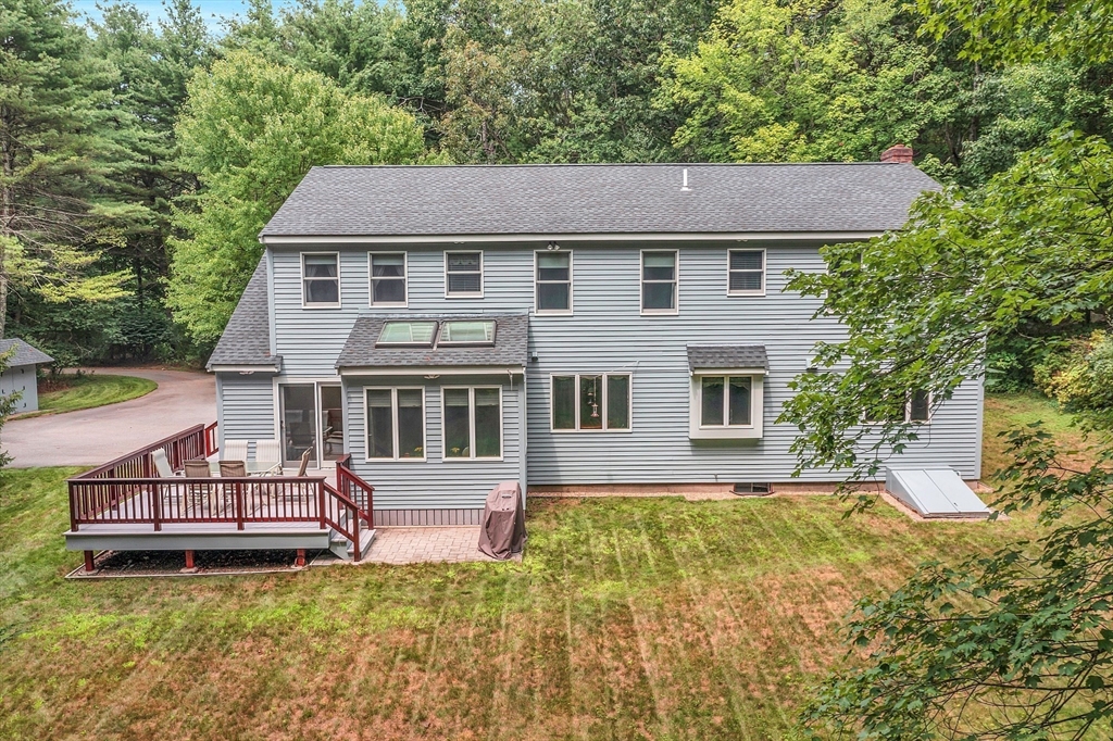 624 Old Harvard Road Boxborough, MA 01719 - Photo 34 of 42 a aerial view of a house with swimming pool next to a yard