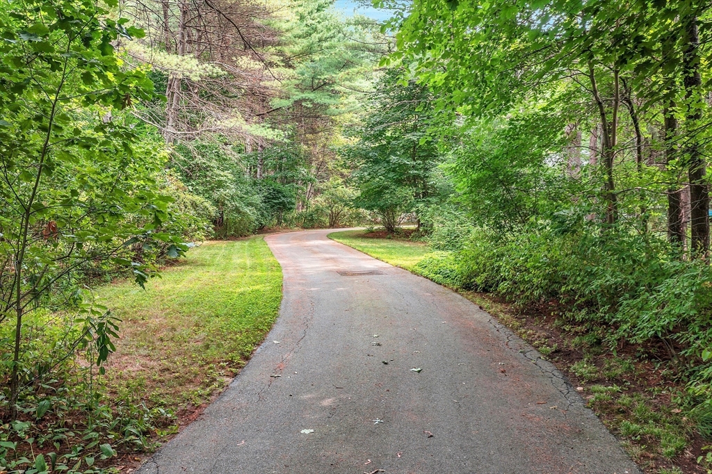624 Old Harvard Road Boxborough, MA 01719 - Photo 37 of 42 a view of a pathway with a yard