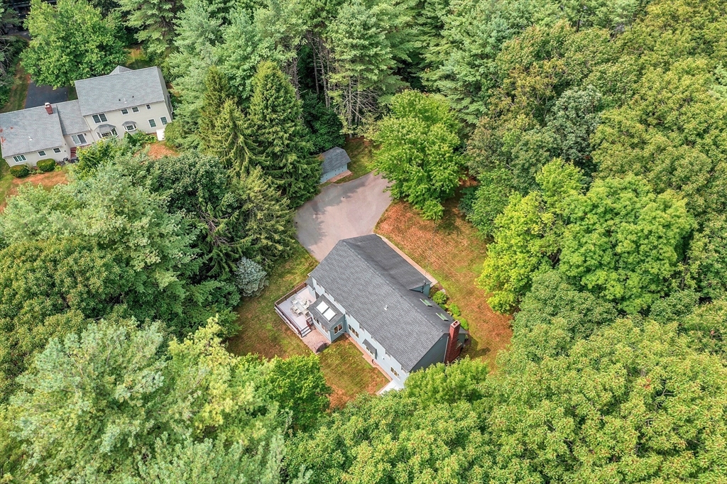 624 Old Harvard Road Boxborough, MA 01719 - Photo 39 of 42 an aerial view of a house with a yard and trees all around