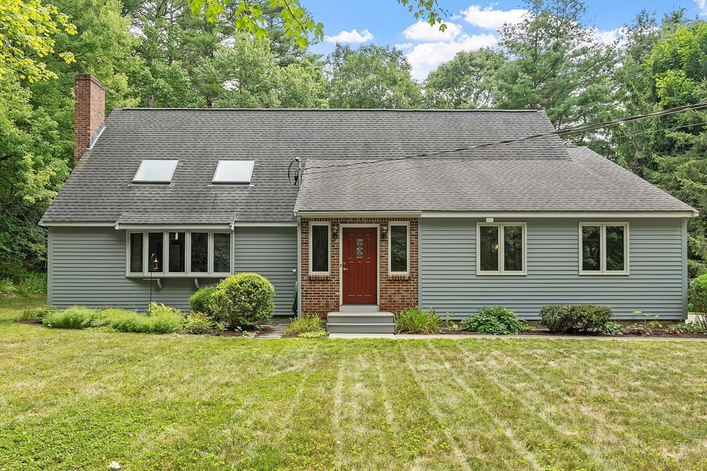 624 Old Harvard Road Boxborough, MA 01719 - Photo 4 of 42 front view of a house with a yard