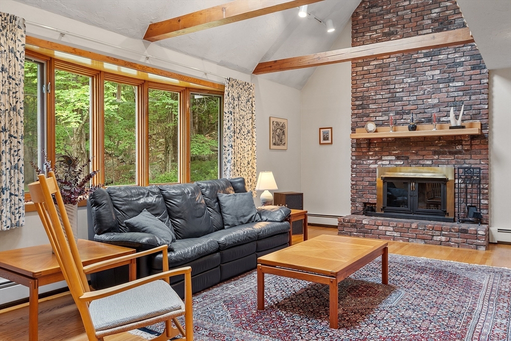 624 Old Harvard Road Boxborough, MA 01719 - Photo 6 of 42 a living room with furniture and a fireplace