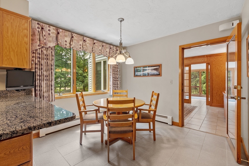 624 Old Harvard Road Boxborough, MA 01719 - Photo 10 of 42 a dining room with furniture and window